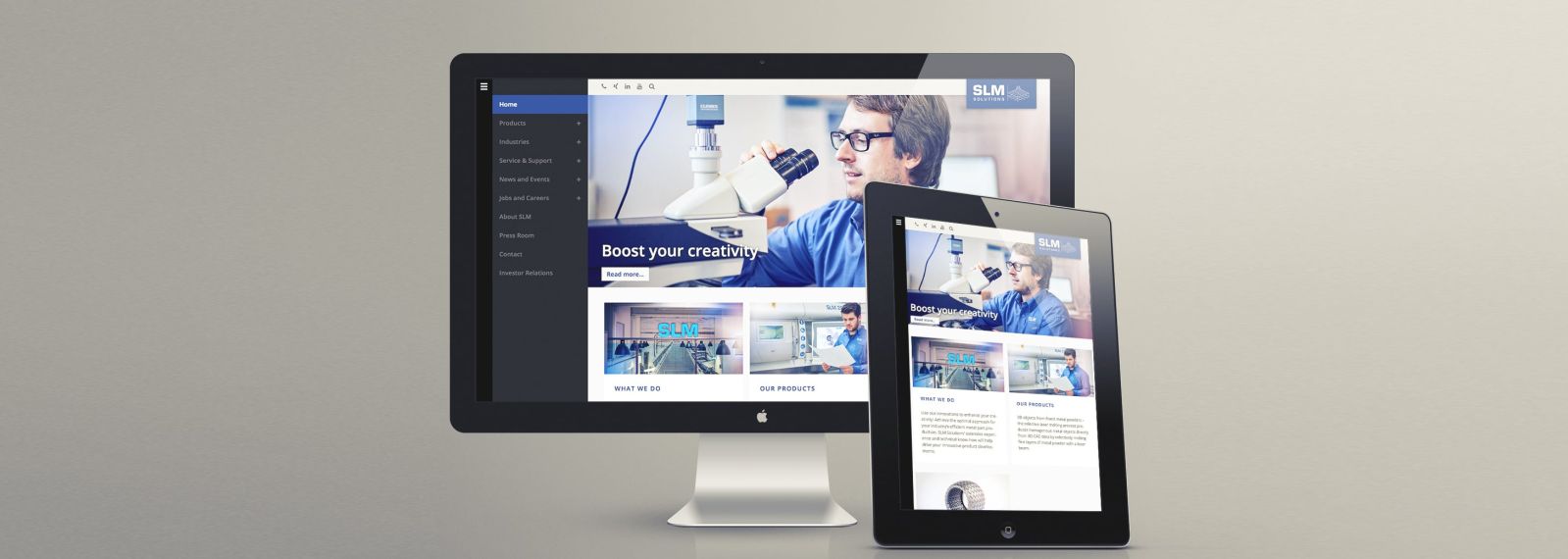 SLM Solutions Group AG auf einem Desktop-Bildschirm und einem Tablet SLM Solutions Group AG auf einem Desktop-Bildschirm und einem Tablet